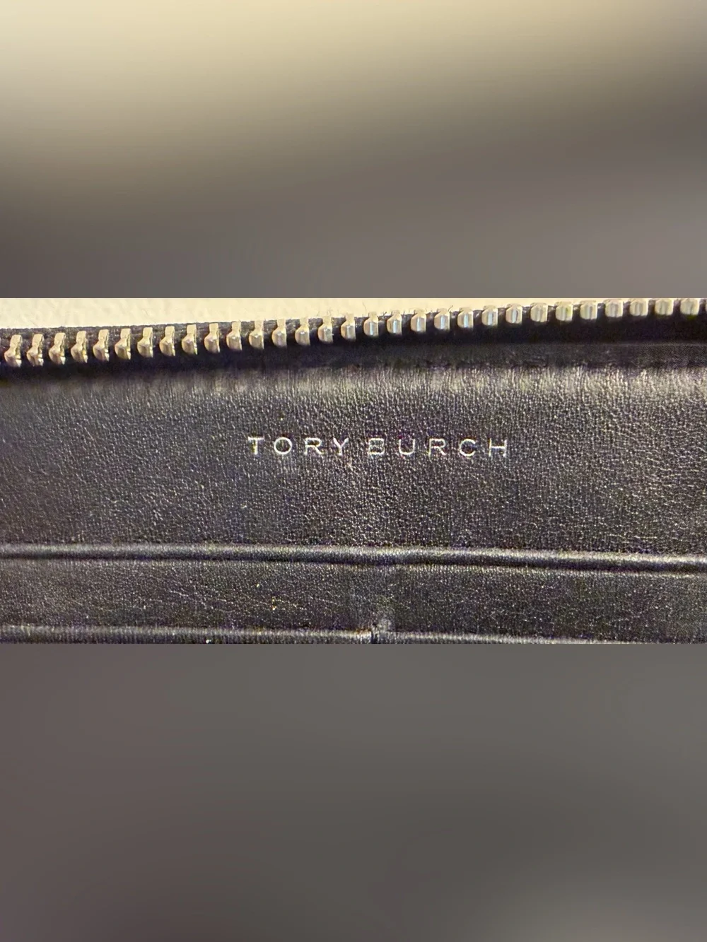 Tory Burch zip around continental wallet with snakeskin.